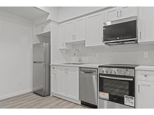 149 Belmont Way Sw, Calgary, AB - Indoor Photo Showing Kitchen