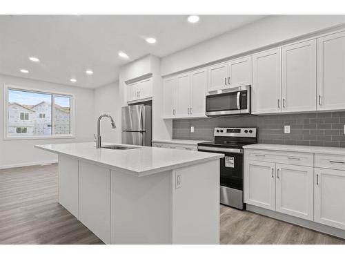 149 Belmont Way Sw, Calgary, AB - Indoor Photo Showing Kitchen With Upgraded Kitchen