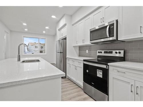 149 Belmont Way Sw, Calgary, AB - Indoor Photo Showing Kitchen With Double Sink With Upgraded Kitchen