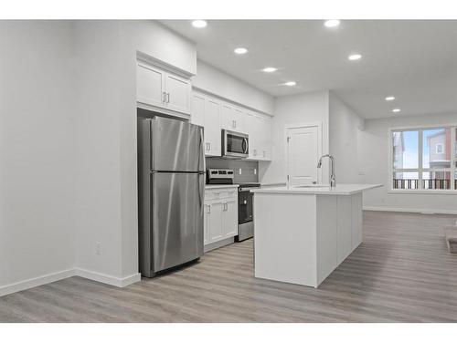 149 Belmont Way Sw, Calgary, AB - Indoor Photo Showing Kitchen With Upgraded Kitchen