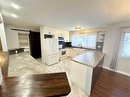 5210 44 Street, Olds, AB - Indoor Photo Showing Kitchen With Double Sink