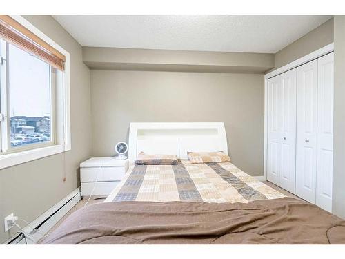 218-15 Saddlestone Way Ne, Calgary, AB - Indoor Photo Showing Bedroom