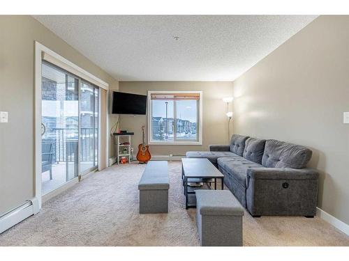 218-15 Saddlestone Way Ne, Calgary, AB - Indoor Photo Showing Living Room