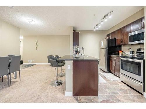 218-15 Saddlestone Way Ne, Calgary, AB - Indoor Photo Showing Kitchen