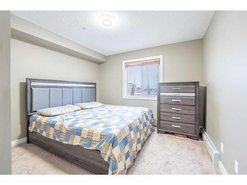 218-15 Saddlestone Way Ne, Calgary, AB - Indoor Photo Showing Bedroom