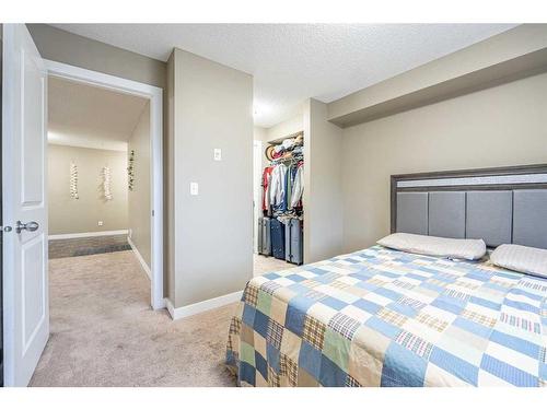 218-15 Saddlestone Way Ne, Calgary, AB - Indoor Photo Showing Bedroom