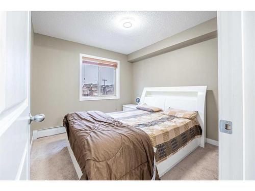 218-15 Saddlestone Way Ne, Calgary, AB - Indoor Photo Showing Bedroom