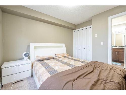 218-15 Saddlestone Way Ne, Calgary, AB - Indoor Photo Showing Bedroom