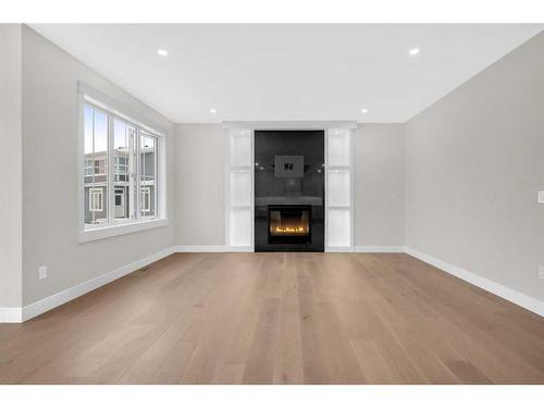 11 South Shore Road, Chestermere, AB - Indoor Photo Showing Living Room With Fireplace