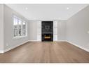 11 South Shore Road, Chestermere, AB  - Indoor Photo Showing Living Room With Fireplace 