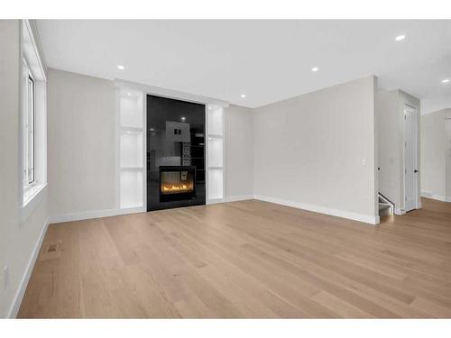 11 South Shore Road, Chestermere, AB - Indoor Photo Showing Living Room With Fireplace