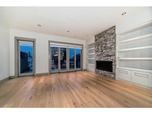 2410 30 Avenue Sw, Calgary, AB - Indoor Photo Showing Living Room With Fireplace