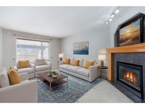 209 Douglas Glen Boulevard Se, Calgary, AB - Indoor Photo Showing Living Room With Fireplace