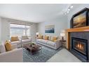 209 Douglas Glen Boulevard Se, Calgary, AB  - Indoor Photo Showing Living Room With Fireplace 