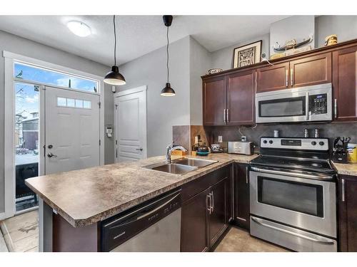 1007 Evanston Square Nw, Calgary, AB - Indoor Photo Showing Kitchen With Double Sink