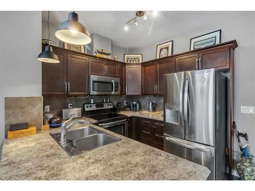 1007 Evanston Square Nw, Calgary, AB - Indoor Photo Showing Kitchen With Stainless Steel Kitchen With Double Sink With Upgraded Kitchen