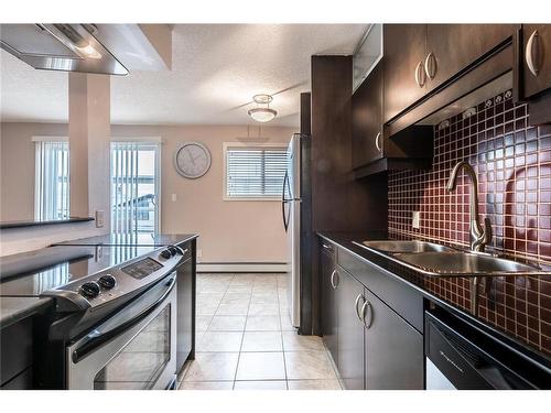 303-1826 11 Avenue Sw, Calgary, AB - Indoor Photo Showing Kitchen With Double Sink