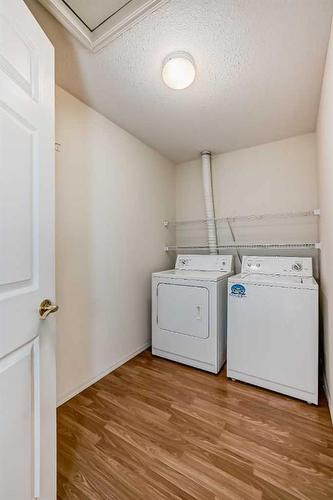 21-7720 39 Avenue Nw, Calgary, AB - Indoor Photo Showing Laundry Room