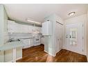 21-7720 39 Avenue Nw, Calgary, AB  - Indoor Photo Showing Kitchen With Double Sink 