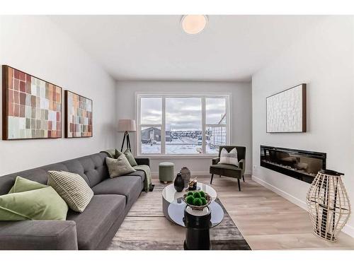 100 Wolf Hollow Villas Se, Calgary, AB - Indoor Photo Showing Living Room With Fireplace