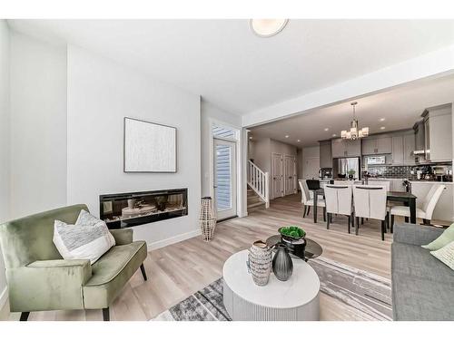 100 Wolf Hollow Villas Se, Calgary, AB - Indoor Photo Showing Living Room With Fireplace