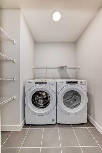 100 Wolf Hollow Villas Se, Calgary, AB - Indoor Photo Showing Laundry Room