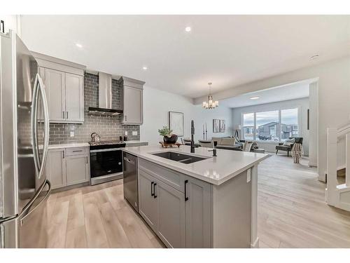 100 Wolf Hollow Villas Se, Calgary, AB - Indoor Photo Showing Kitchen With Double Sink With Upgraded Kitchen