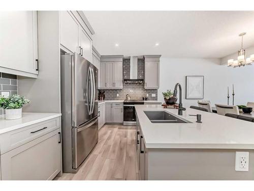 100 Wolf Hollow Villas Se, Calgary, AB - Indoor Photo Showing Kitchen With Double Sink With Upgraded Kitchen