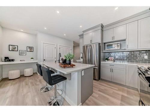 100 Wolf Hollow Villas Se, Calgary, AB - Indoor Photo Showing Kitchen With Upgraded Kitchen