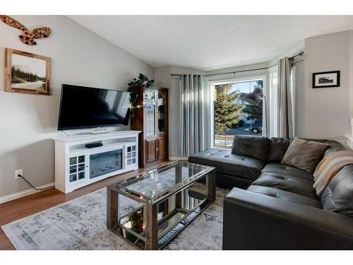 62 Jensen Heights Place Ne, Airdrie, AB - Indoor Photo Showing Living Room With Fireplace