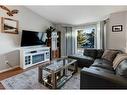 62 Jensen Heights Place Ne, Airdrie, AB  - Indoor Photo Showing Living Room With Fireplace 