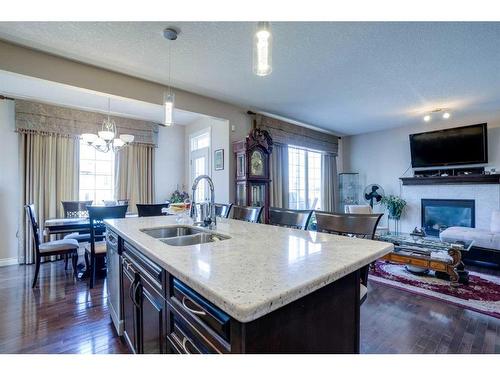 405 Taralake Landing Ne, Calgary, AB - Indoor Photo Showing Kitchen With Fireplace With Double Sink