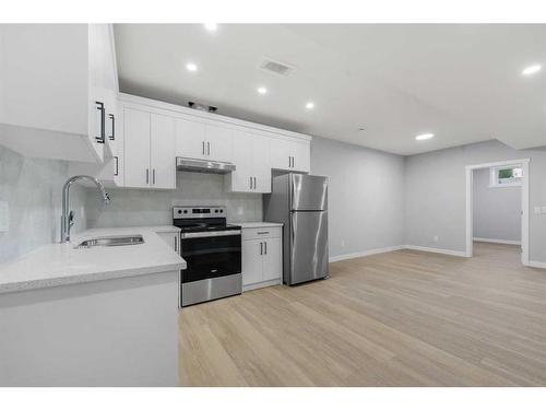 296 Hotchkiss Drive Se, Calgary, AB - Indoor Photo Showing Kitchen With Stainless Steel Kitchen