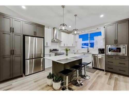 84 Wolf Gate, Okotoks, AB - Indoor Photo Showing Kitchen With Upgraded Kitchen