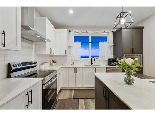 84 Wolf Gate, Okotoks, AB - Indoor Photo Showing Kitchen With Upgraded Kitchen