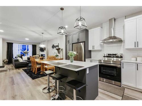 84 Wolf Gate, Okotoks, AB - Indoor Photo Showing Kitchen With Upgraded Kitchen