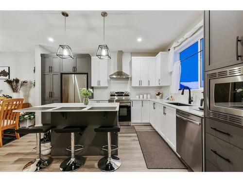 84 Wolf Gate, Okotoks, AB - Indoor Photo Showing Kitchen With Upgraded Kitchen