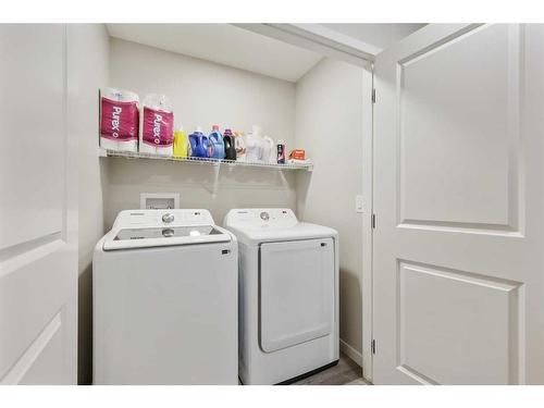 84 Wolf Gate, Okotoks, AB - Indoor Photo Showing Laundry Room