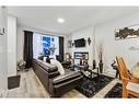 84 Wolf Gate, Okotoks, AB  - Indoor Photo Showing Living Room With Fireplace 