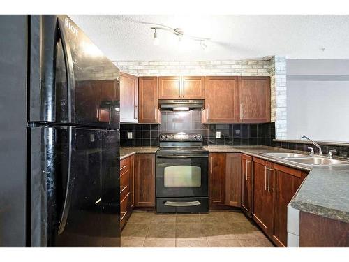 3105-60 Panatella Street Nw, Calgary, AB - Indoor Photo Showing Kitchen With Double Sink