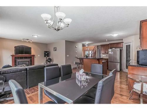 85 Sherwood Common Nw, Calgary, AB - Indoor Photo Showing Dining Room With Fireplace