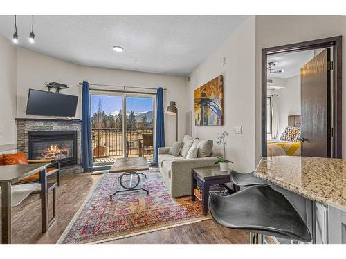 208-901 Mountain Street, Canmore, AB - Indoor Photo Showing Living Room With Fireplace