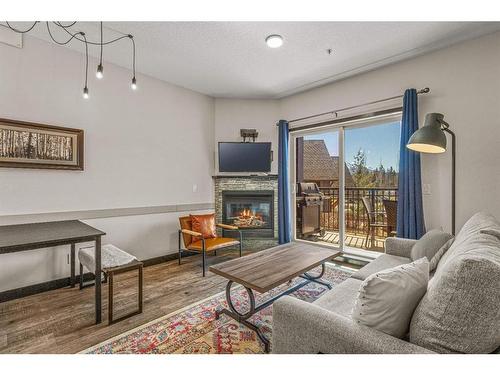 208-901 Mountain Street, Canmore, AB - Indoor Photo Showing Living Room With Fireplace