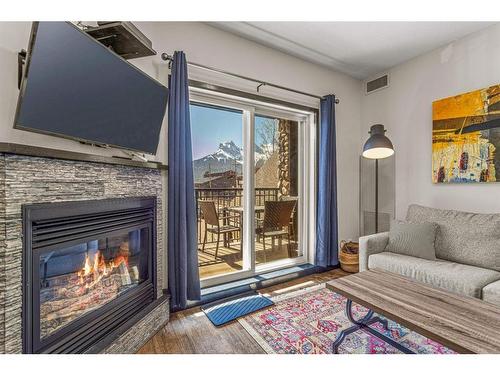 208-901 Mountain Street, Canmore, AB - Indoor Photo Showing Living Room With Fireplace