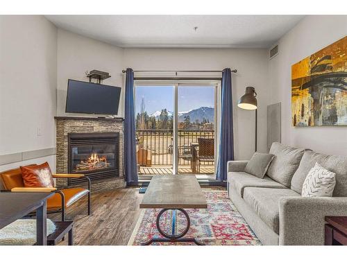 208-901 Mountain Street, Canmore, AB - Indoor Photo Showing Living Room With Fireplace