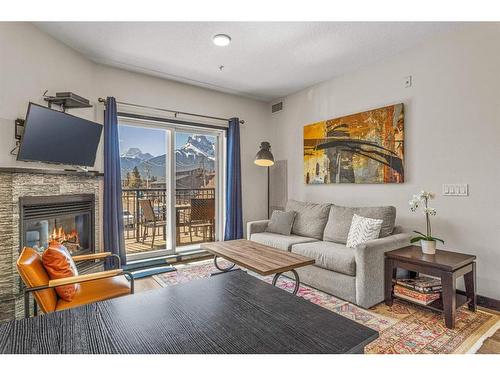 208-901 Mountain Street, Canmore, AB - Indoor Photo Showing Living Room With Fireplace