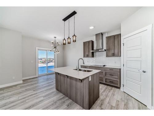 58 Cobbleridge Place Sw, Airdrie, AB - Indoor Photo Showing Kitchen With Double Sink With Upgraded Kitchen