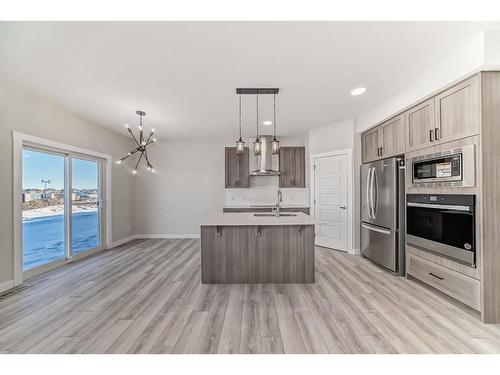 58 Cobbleridge Place Sw, Airdrie, AB - Indoor Photo Showing Kitchen With Double Sink