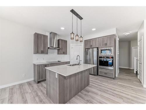 58 Cobbleridge Place Sw, Airdrie, AB - Indoor Photo Showing Kitchen With Double Sink With Upgraded Kitchen