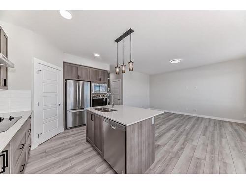 58 Cobbleridge Place Sw, Airdrie, AB - Indoor Photo Showing Kitchen With Double Sink With Upgraded Kitchen